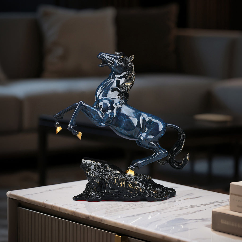 Blue Ma Dao Cheng Gong rearing horse sculpture styled on a living room console