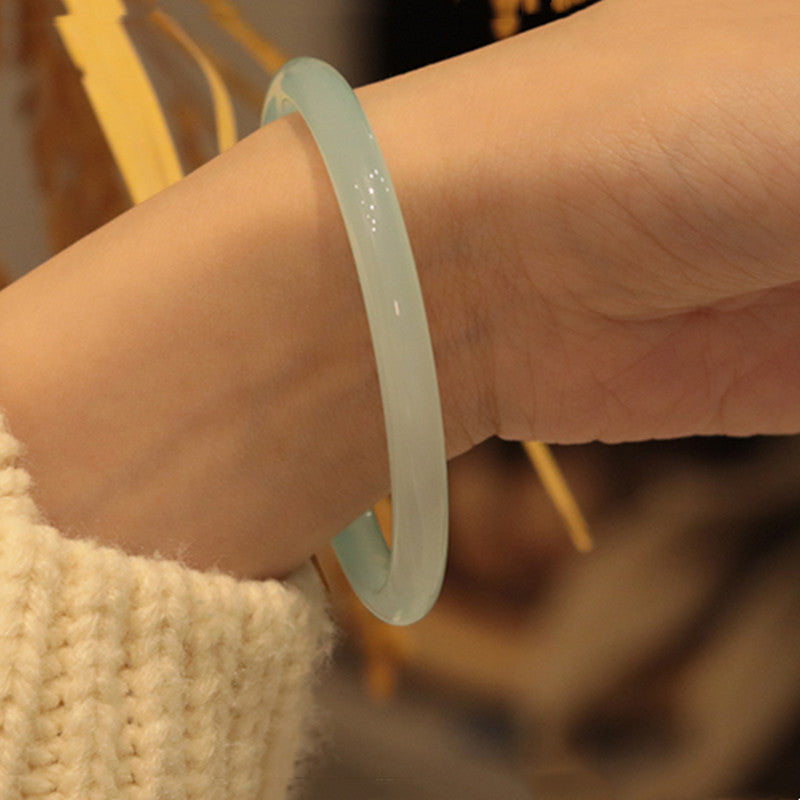Natural chalcedony beauty bangle showing watery translucency and polish