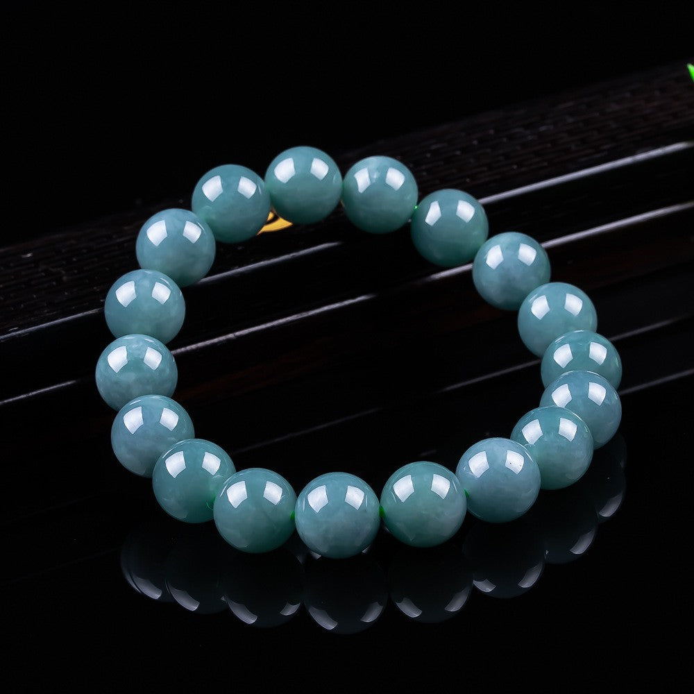 12 mm polished blue green jadeite bead bracelet close up