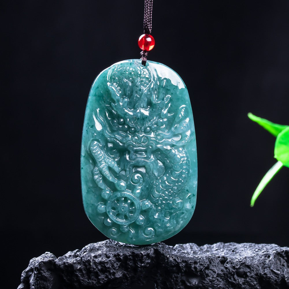 Blue water jadeite dragon plaque showing carved scale and cloud details