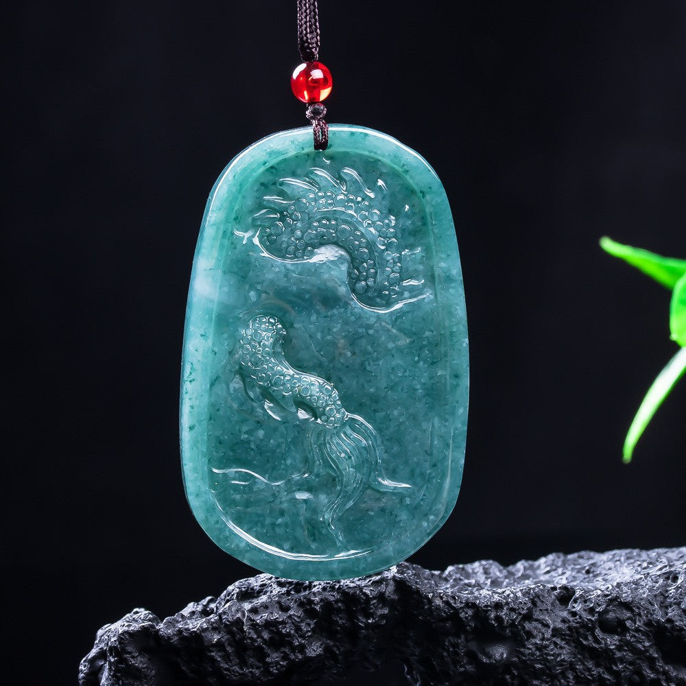 Translucent blue water jadeite dragon carving under light