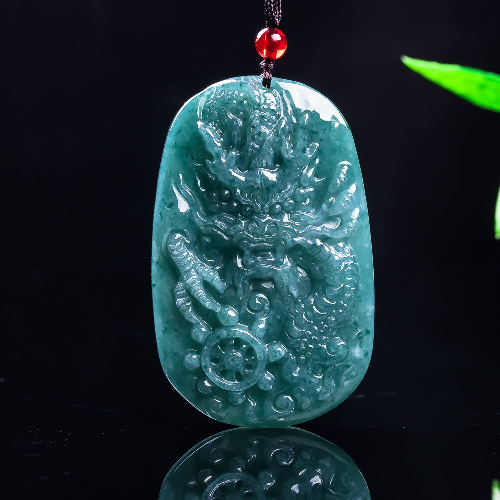 Certified jadeite dragon pendant showing substantial 65.9 millimeter scale