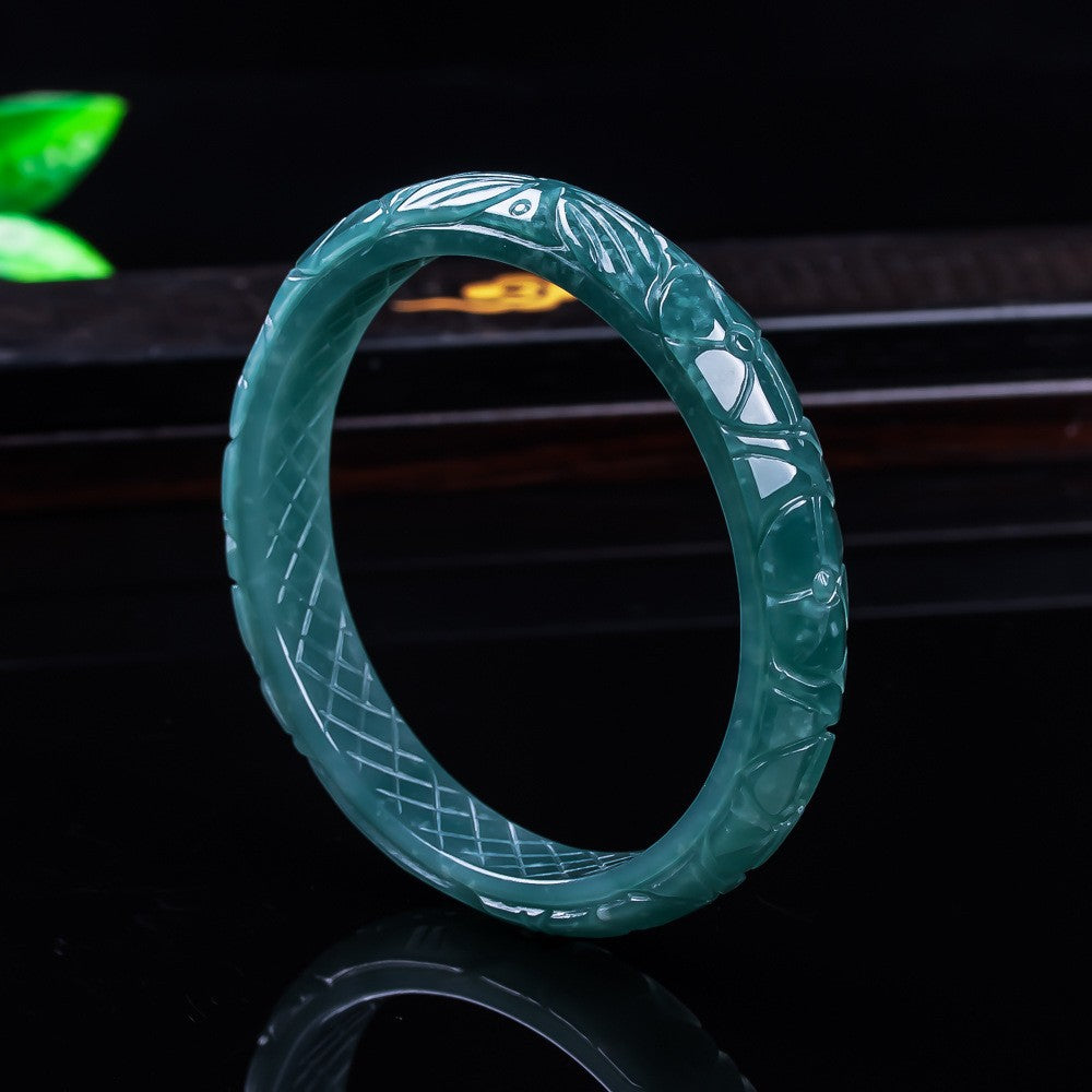Carved natural jadeite dragon phoenix bangle close-up polish detail