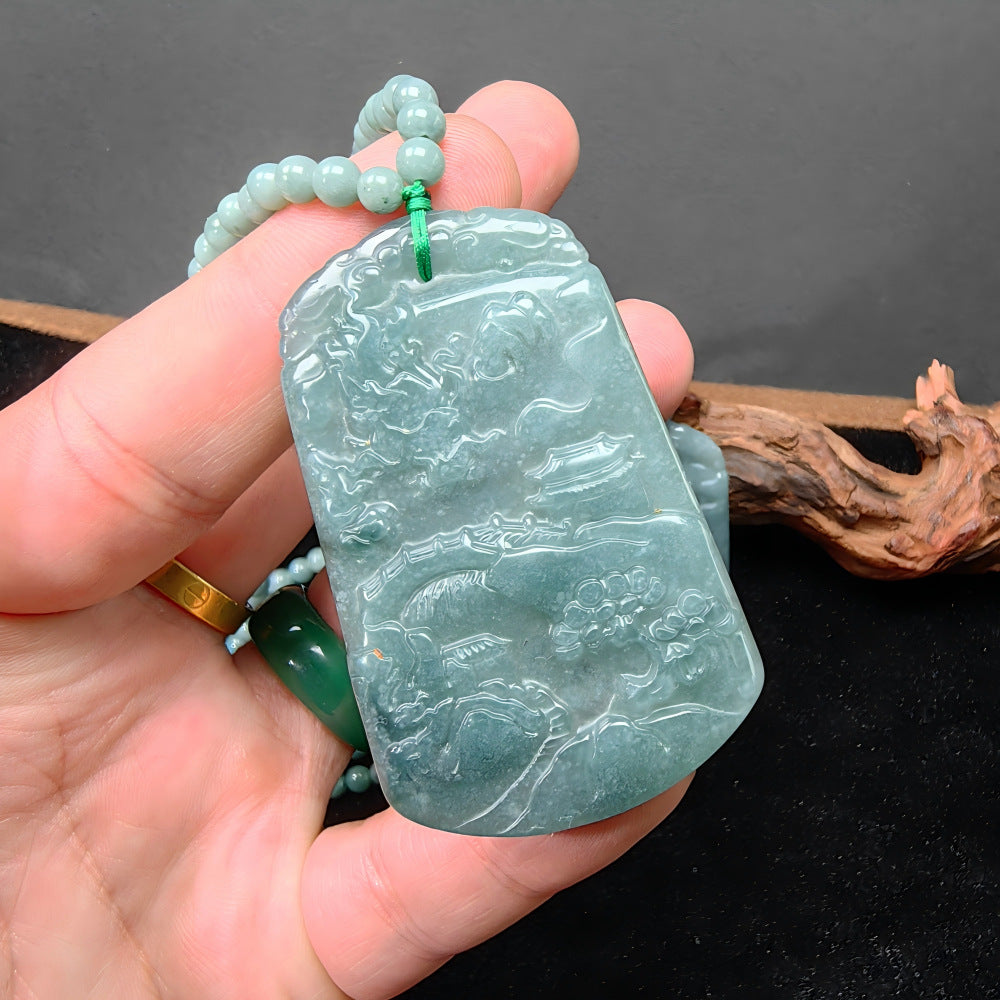 Blue water jadeite mountain landscape pendant with dragon and pavilion relief carving