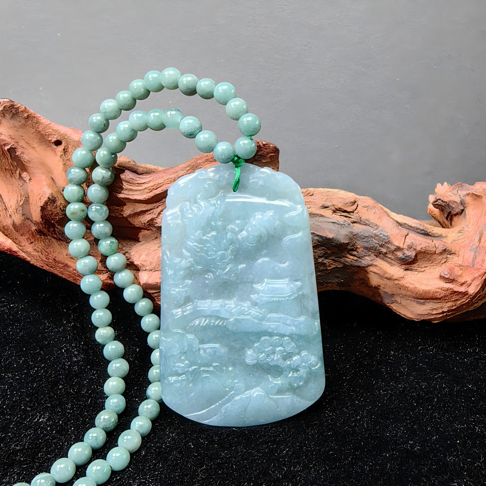Carved blue green jadeite mountain water pendant with matching bead strand