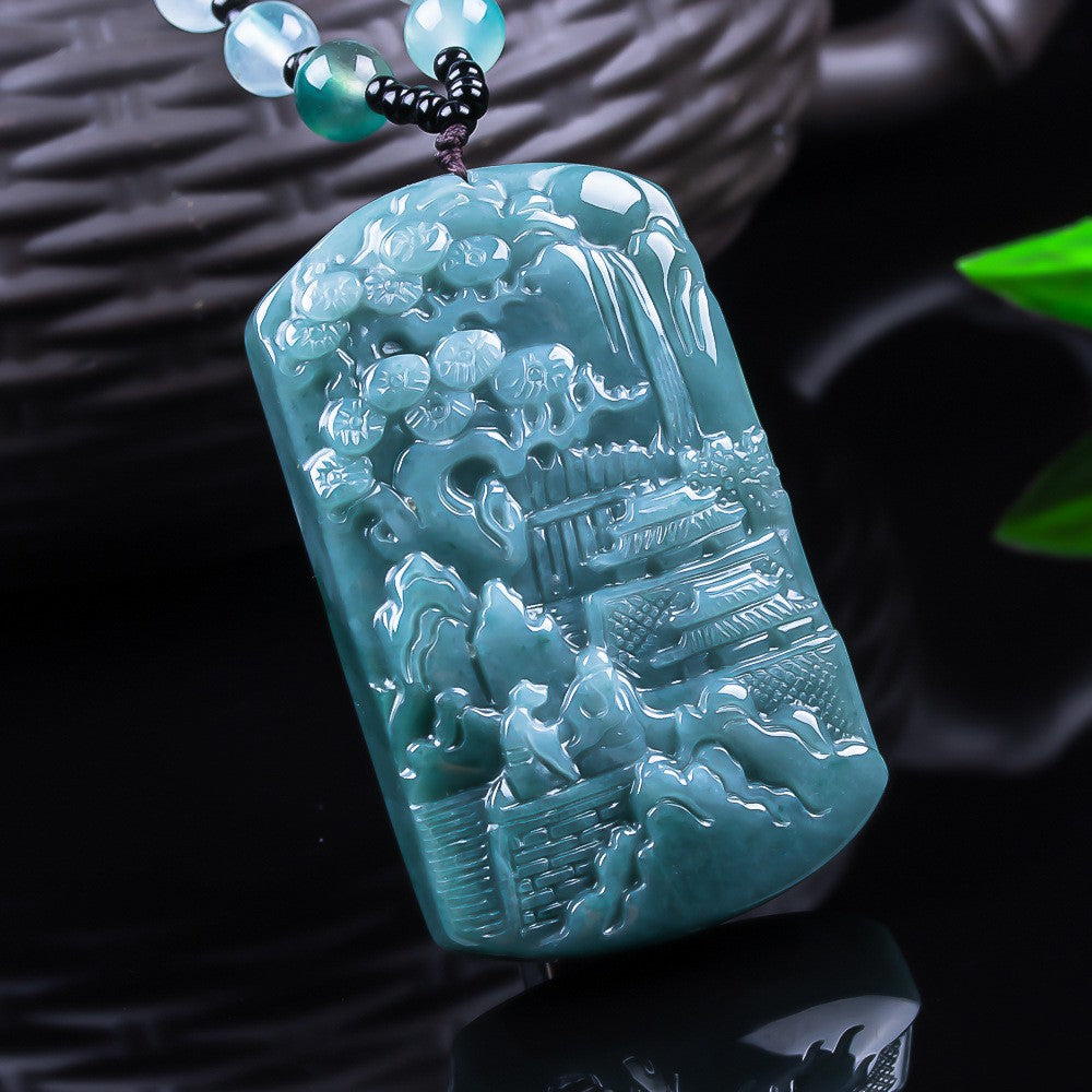 Translucent blue water jadeite landscape plaque under light