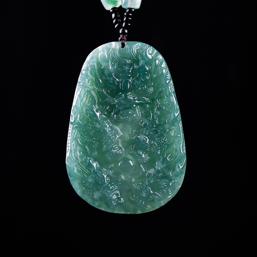 Thick jadeite nine dragon plaque showing polished carved surface