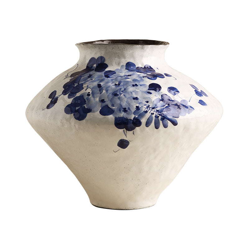 Wide low blue and white ceramic flower vessel in wisteria motif