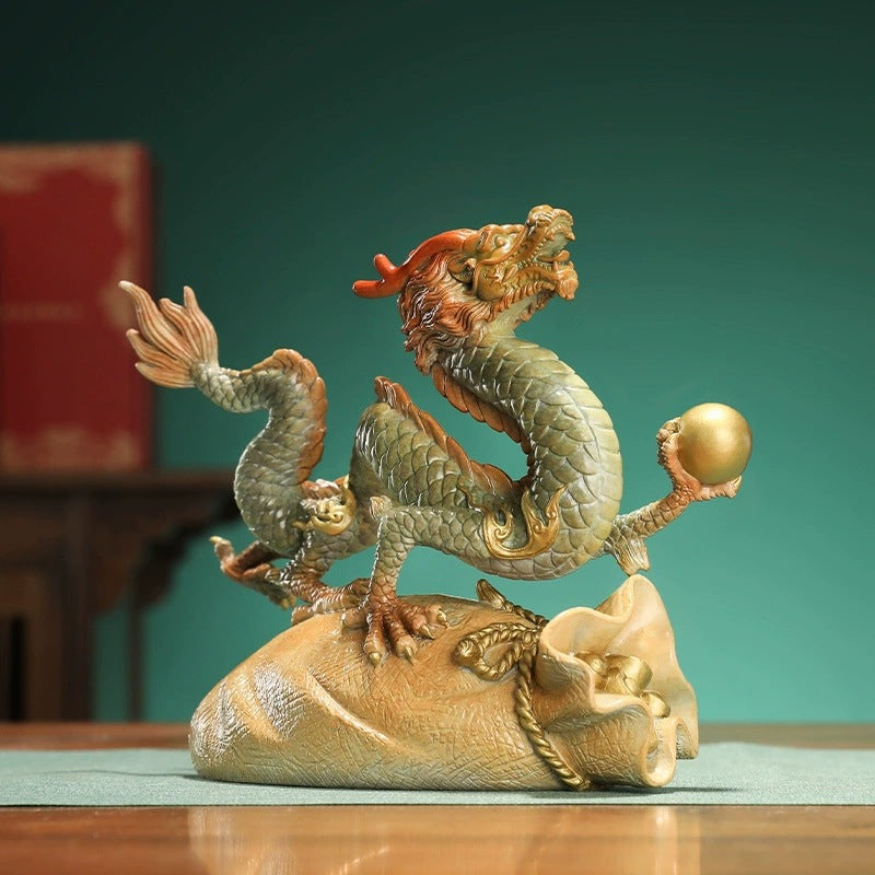 Large brass Chinese dragon Feng Shui sculpture on a gold fortune bag for home office and entrance decor