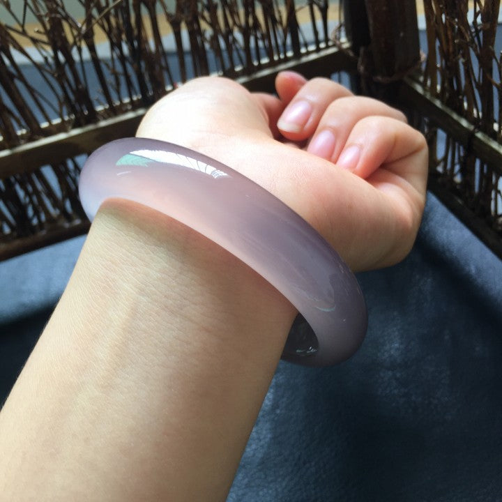 Pink violet chalcedony agate bangle showing translucent stone body