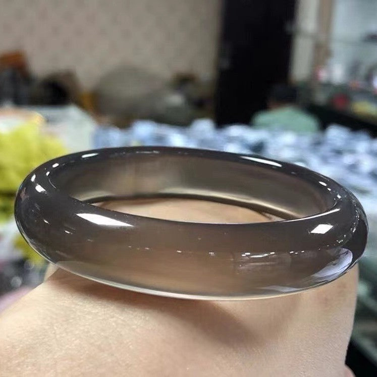 Deep smoky gray Brazilian agate bangle with high-polish translucent finish