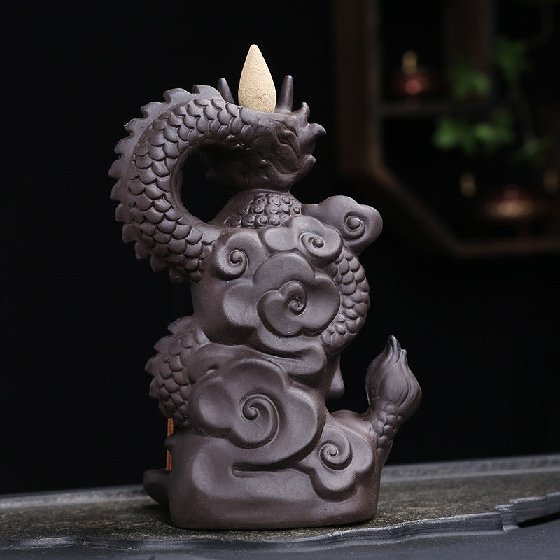 Rear and side view of coiled dragon Buddha incense burner sculpture