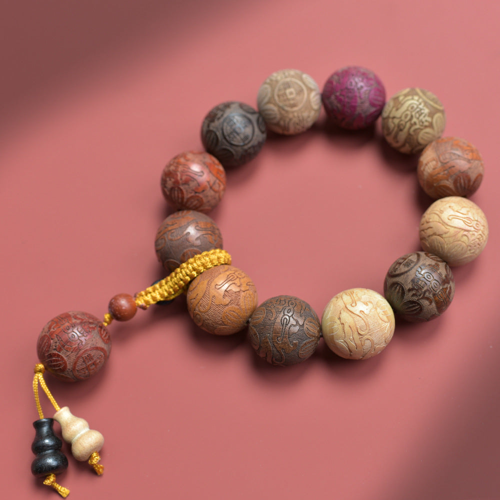 Chinese carved fortune and treasure multi-wood bead bracelet with yellow cord and keychain-style hanging accessory