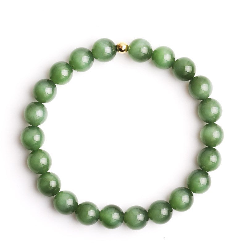Green cat-eye nephrite jade beads with polished chatoyant surface