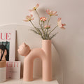 Matte cat shaped ceramic vase in soft pink for playful modern decor