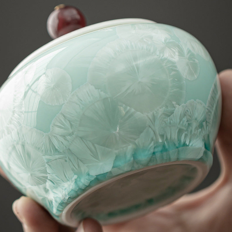 Close-up of celadon crystalline glaze texture on ceramic tea storage jar