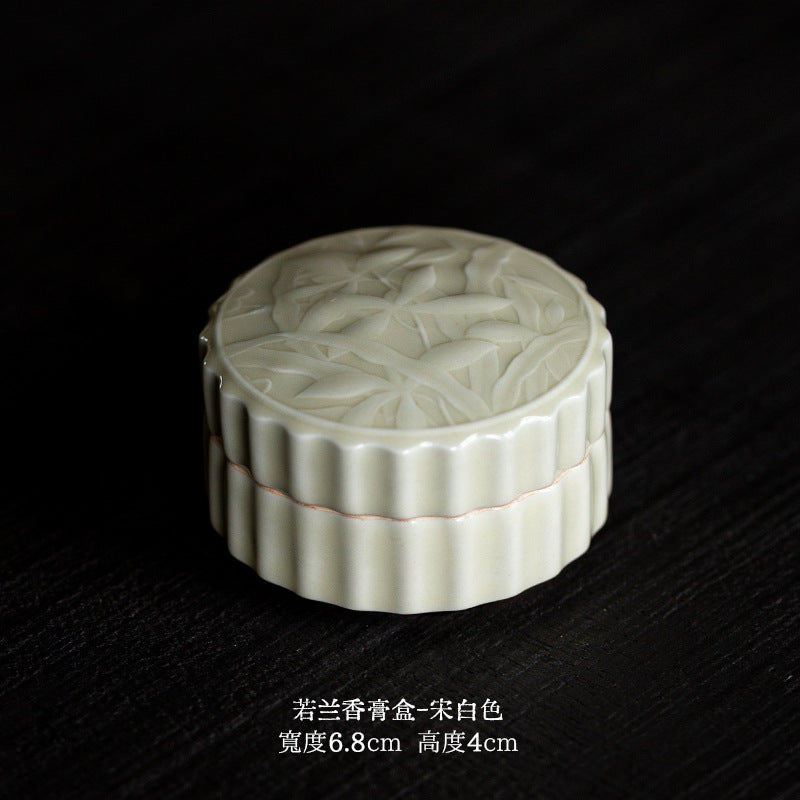 Celadon lotus relief ceramic lidded jar