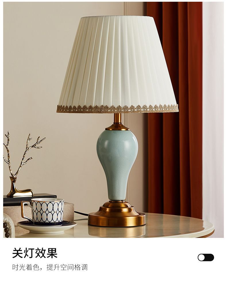 Celadon bedside table lamp with pleated shade in warm romantic interior