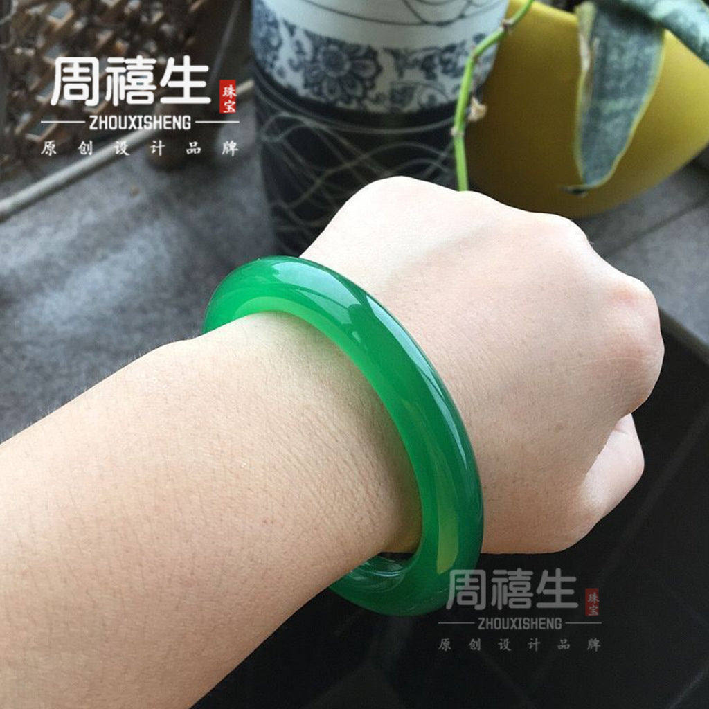 Green chalcedony solid stone bangle showing glossy rounded profile