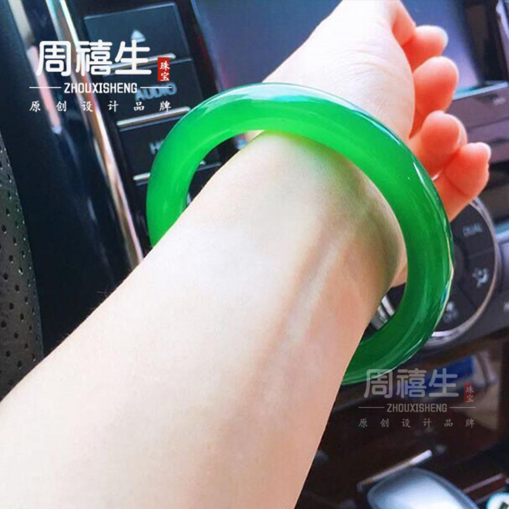 Bright green chalcedony round bar bangle with translucent stone glow
