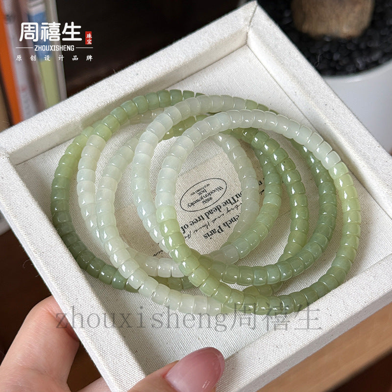 Pale white and green Hetian jade bead bracelets with polished straight cut beads