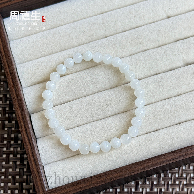 White Hetian jade 6 millimeter round bead bracelet with soft polished luster