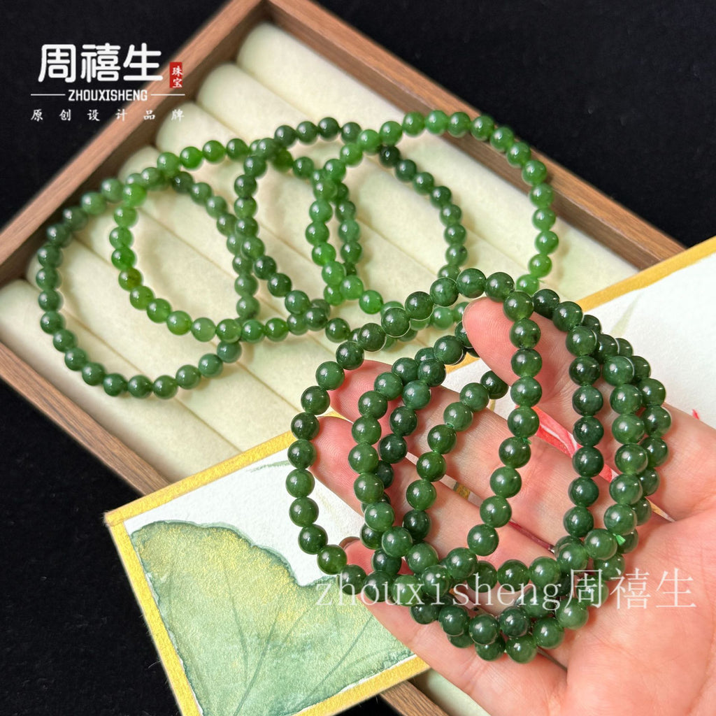 Green Hetian jade round bead bracelet collection with polished bead surfaces