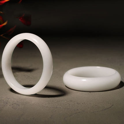 Polished white jade bangle pair showing rounded profile