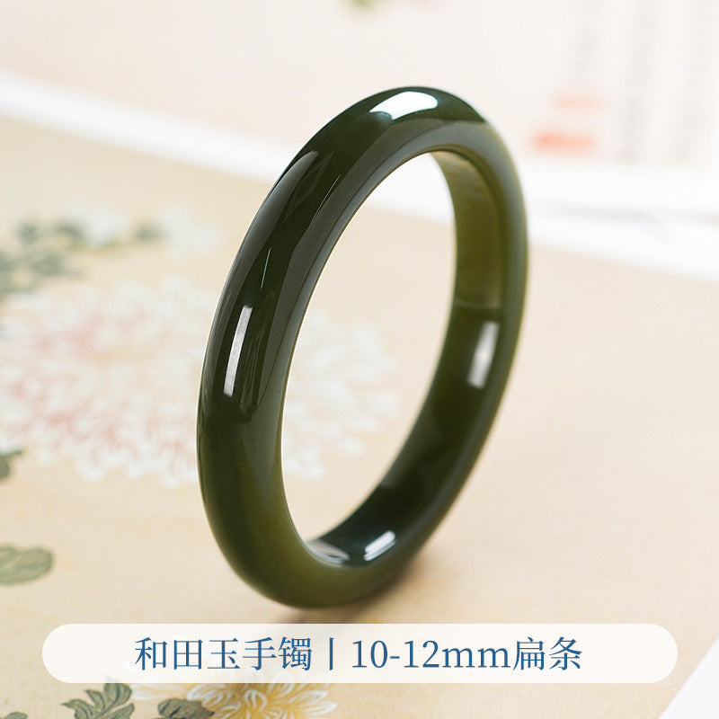 Flat profile green Hetian jade bangle close-up