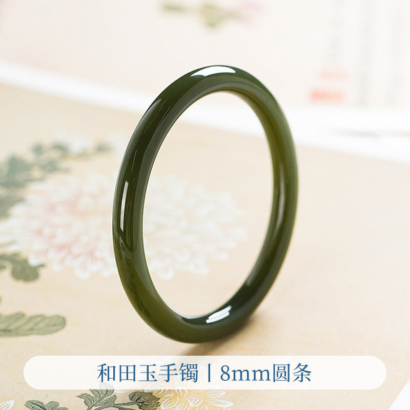 Ink green Hetian jade bangle close-up