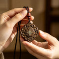 Chenxiang wood carved auspicious floral blessing pendant with turquoise-style inlay