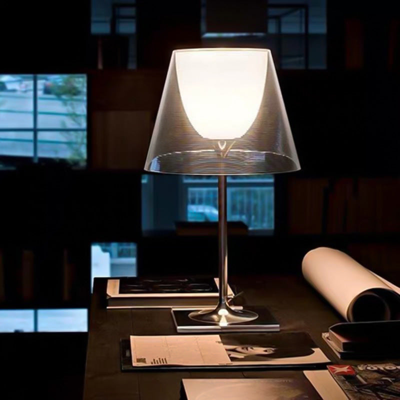 Clear double-layer acrylic table lamp glowing on desk