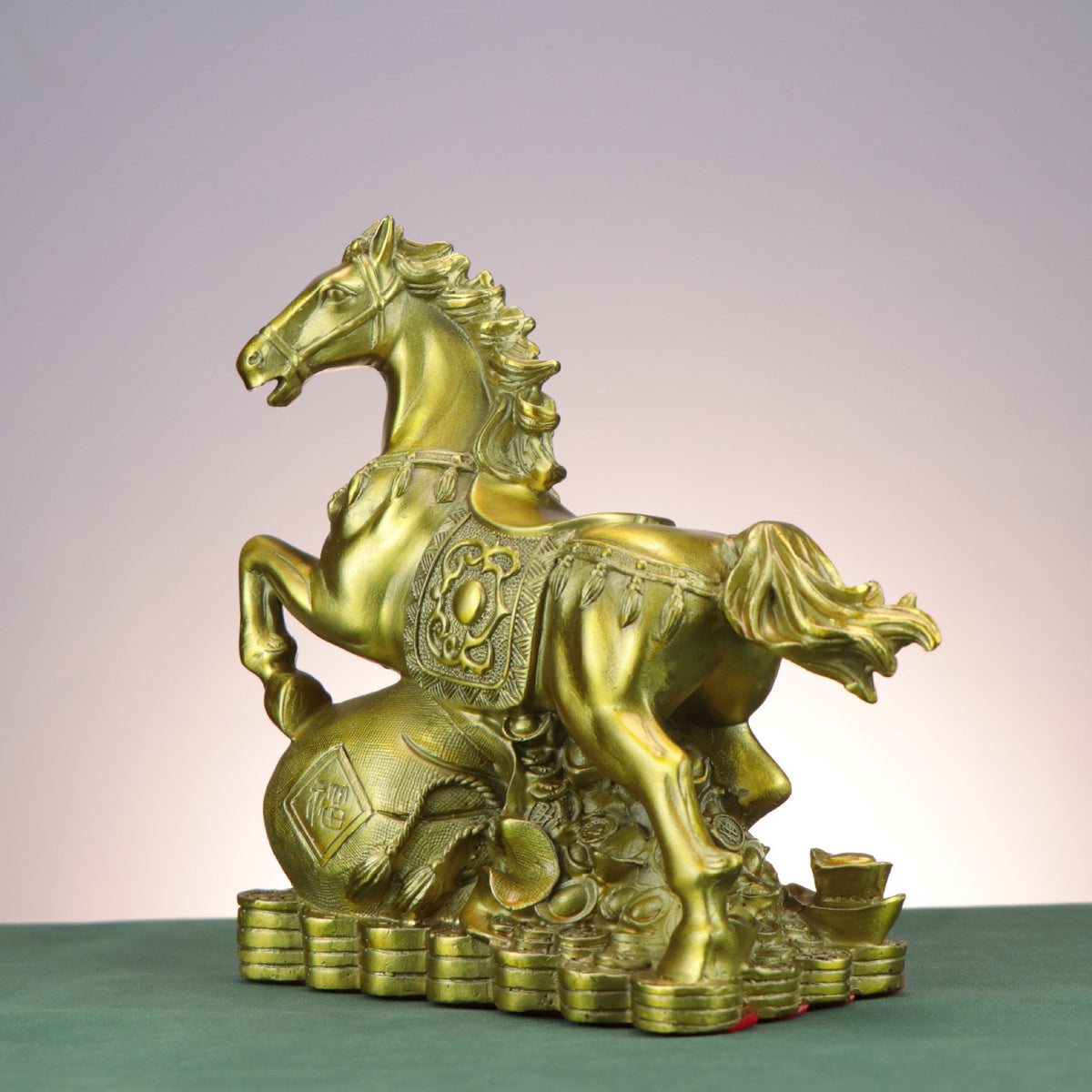 Side view of Chinese copperware fortune horse with Fu money bag, stacked coins and yuanbao ingot details