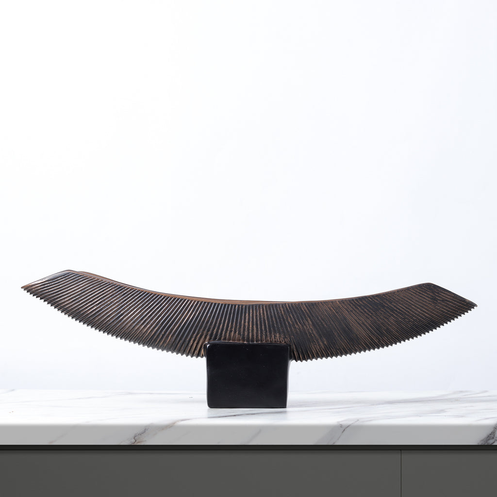 New Chinese dark coffee curved boat-form resin sculpture on black pedestal