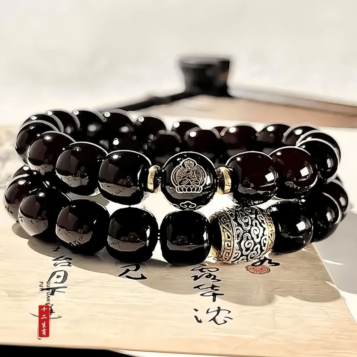 Dark red polished Bodhi root double-wrap bracelet with Chinese zodiac guardian Buddha focal bead and antique-tone spacer