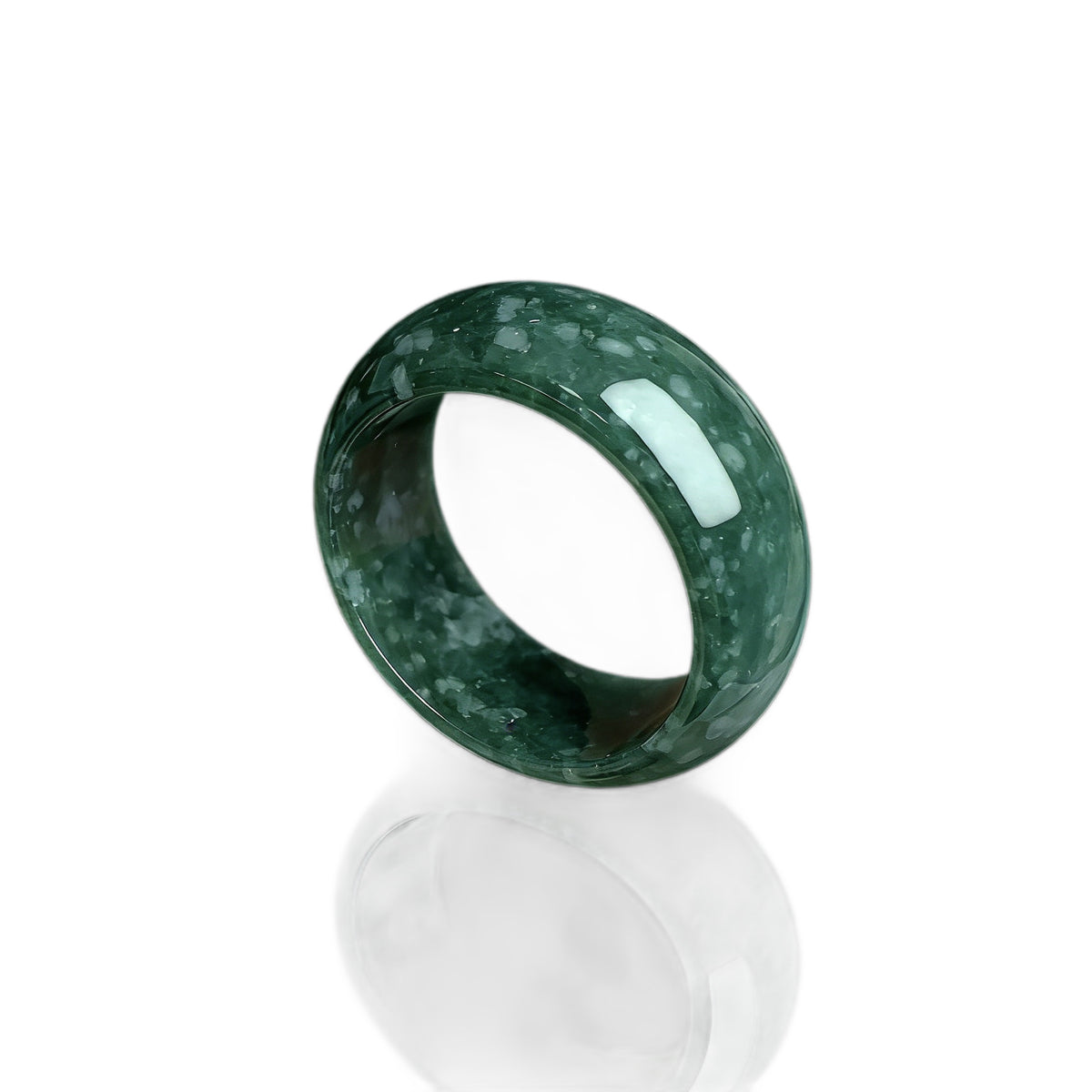 Deep green jadeite wide ring showing cloudy mineral pattern and glossy finish