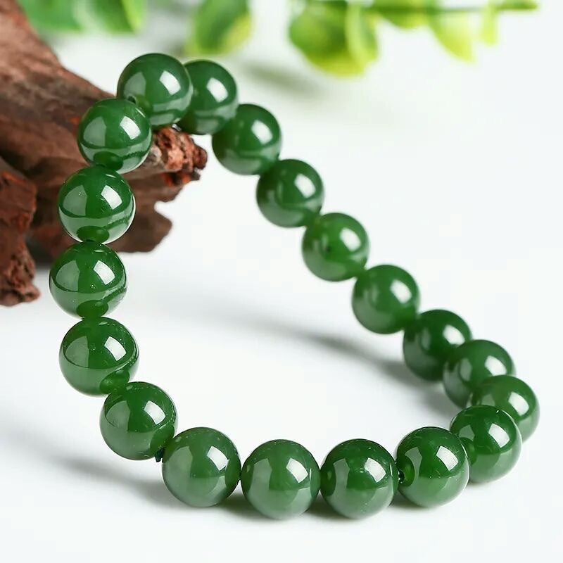 Green polished round bead bracelet styled with natural wood