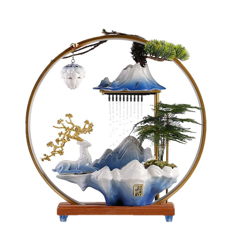 Blue white ceramic mountain fountain with deer and warm LED halo