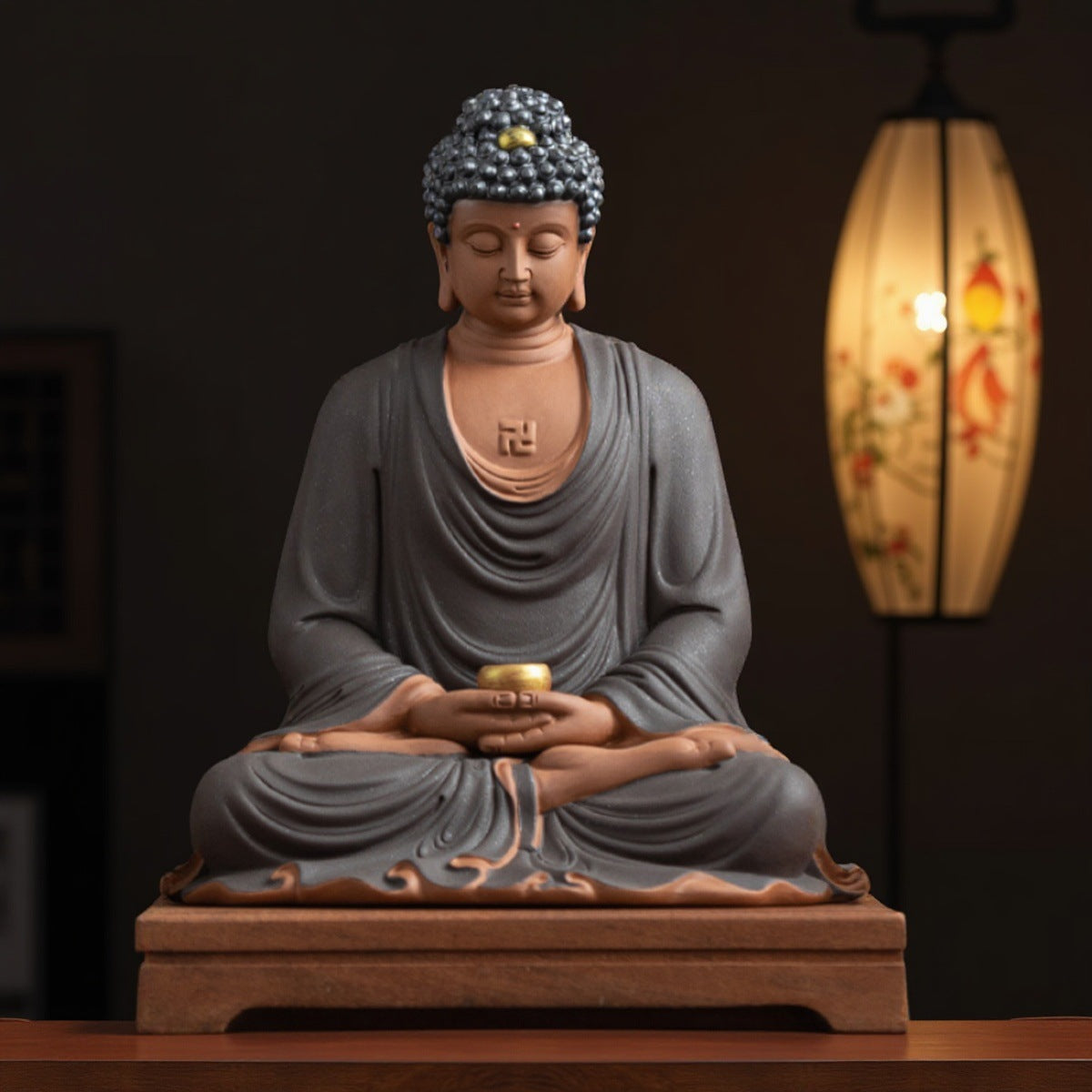 Dehua high-fired ceramic meditating Buddha statue in charcoal gray robe