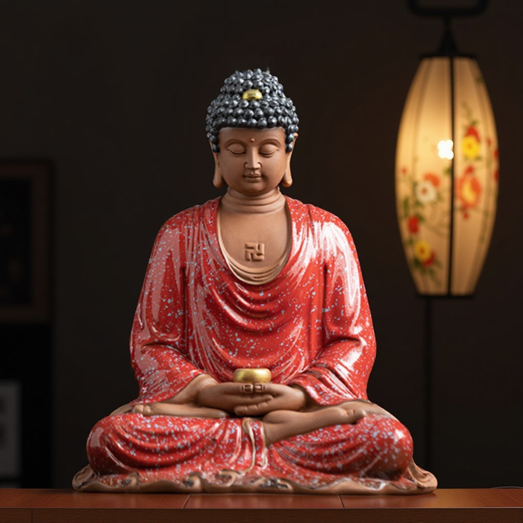 Dehua ceramic Buddha statue with kiln-red robe and seated meditation pose