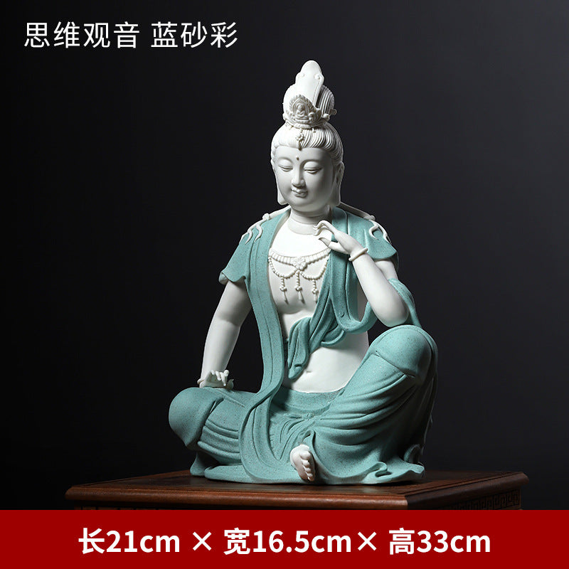 Water Moon Guanyin porcelain sculpture with lotus detail and flowing robes