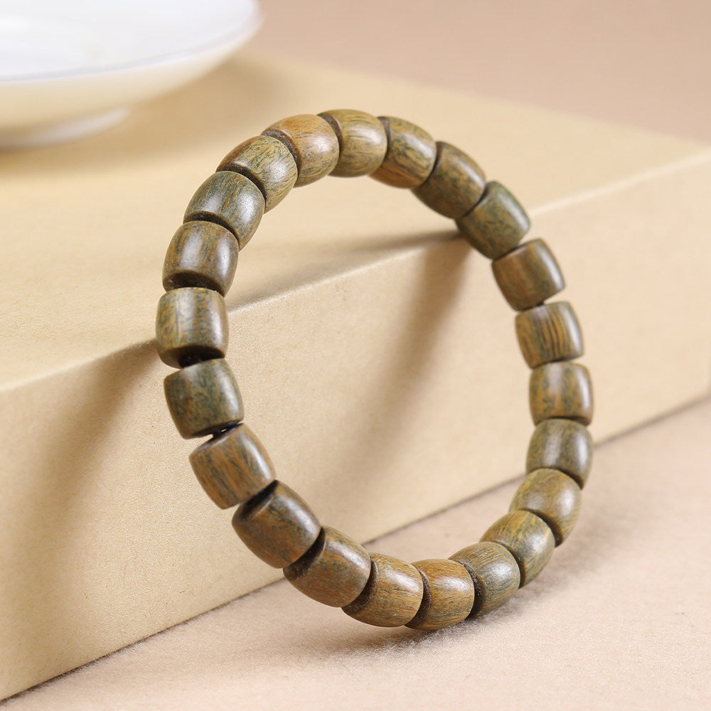 Green sandalwood-style direct-cut old-shape barrel bead bracelet with natural grain