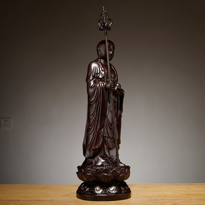 Side detail of Dizang Ksitigarbha Bodhisattva dark wood statue with flowing robes and lotus base