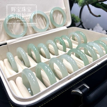 Natural Dongling jade bangle held in hand