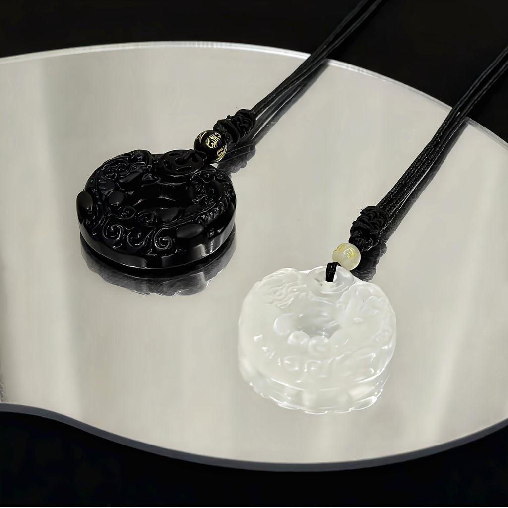 Double Pixiu circular pendant in black obsidian and white chalcedony