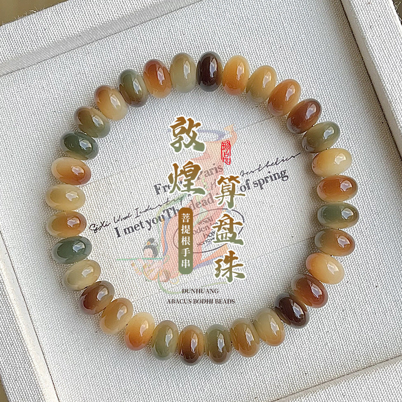 Dunhuang Bodhi root bracelet with multicolor barrel beads in green cream amber and brown tones