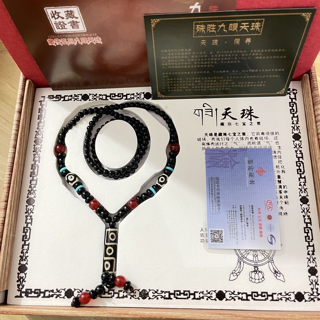 Natural agate nine-eye Dzi necklace with black bead strand and certificate presentation