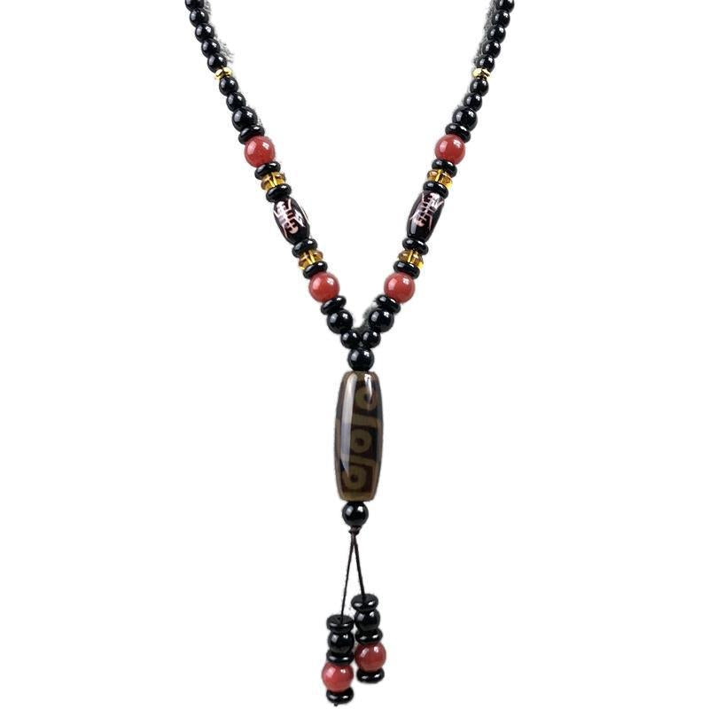 Long black bead necklace with nine-eye Dzi agate focal pendant