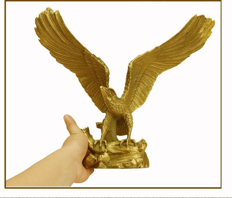 Hand-held view showing scale of spread-wing eagle copper sculpture