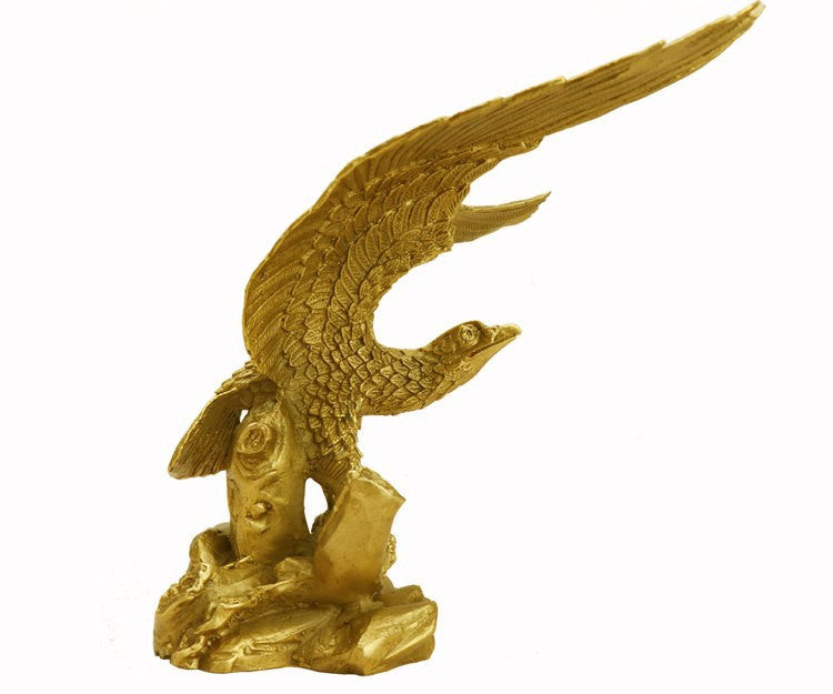 Antique gold eagle sculpture side view with detailed feathers and rocky base